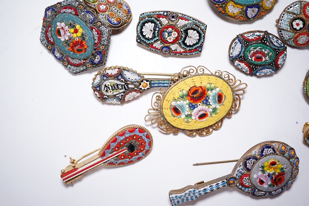 A collection of twenty-five micro-mosaic costume jewellery brooches. Including thirteen banjo and guitars shaped brooches, six large oval and circular brooches and six smaller brooches. Condition - mostly good